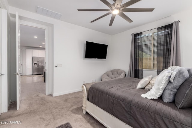 5897 N 195th Dr, Litchfield Park, AZ 85340 - bedroom with stainless steel fridge with ice dispenser, light colored carpet, baseboards, recessed lighting, and a ceiling fan