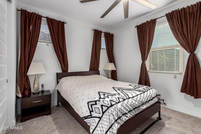 5897 N 195th Dr, Litchfield Park, AZ 85340 - bedroom with carpet floors, multiple windows, ceiling fan, and baseboards