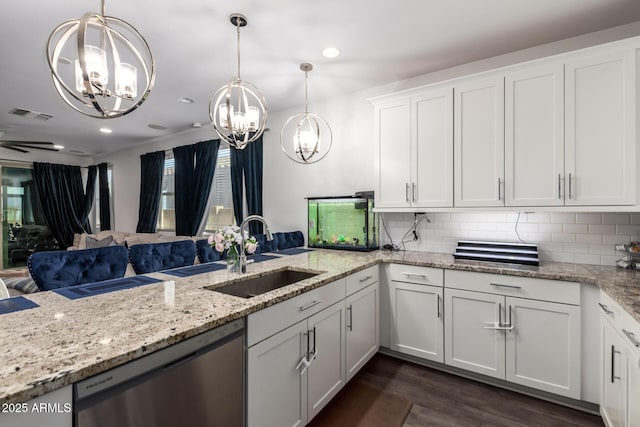 5897 N 195th Dr, Litchfield Park, AZ 85340 - kitchen featuring stainless steel dishwasher, a chandelier, a sink, white cabinets, and dark wood-type flooring