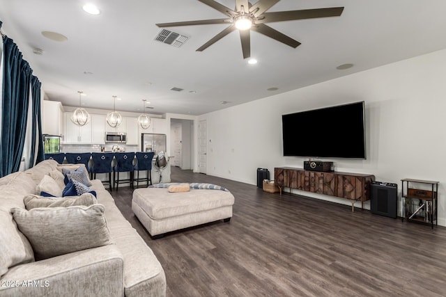 5897 N 195th Dr, Litchfield Park, AZ 85340 - living room with a ceiling fan, dark wood finished floors, recessed lighting, and baseboards