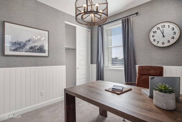 office featuring carpet flooring and a chandelier