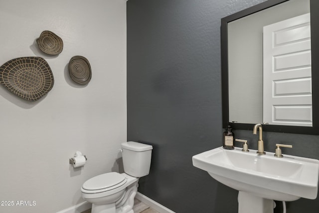 bathroom with sink and toilet