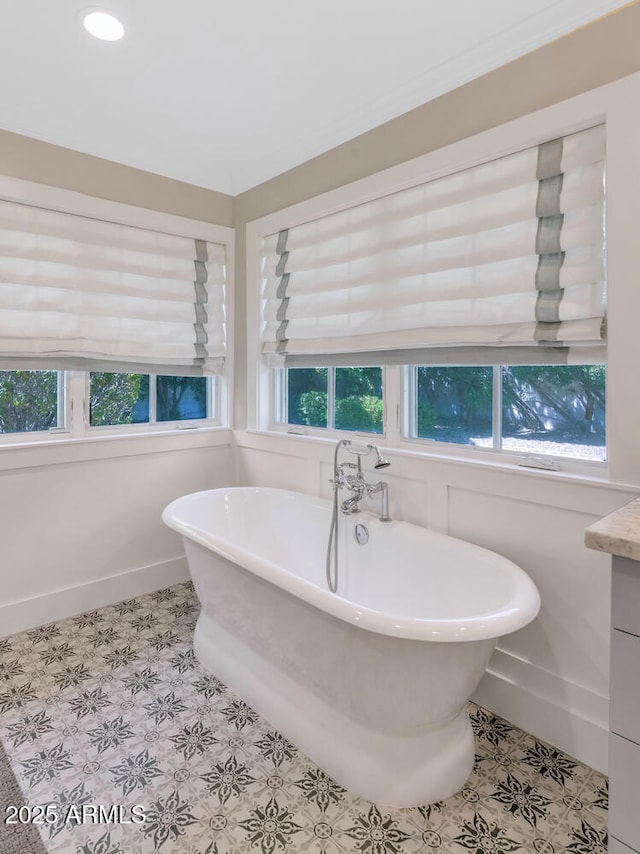 bathroom with vanity and a bathtub