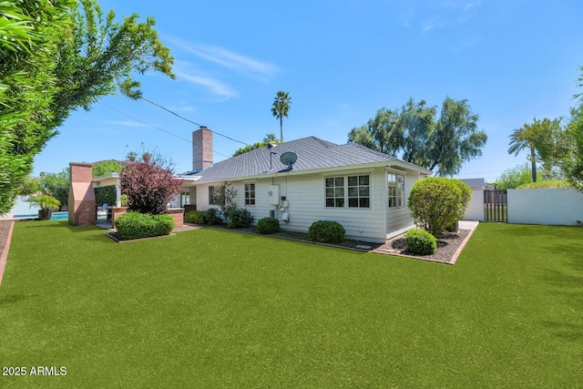 back of house featuring a yard