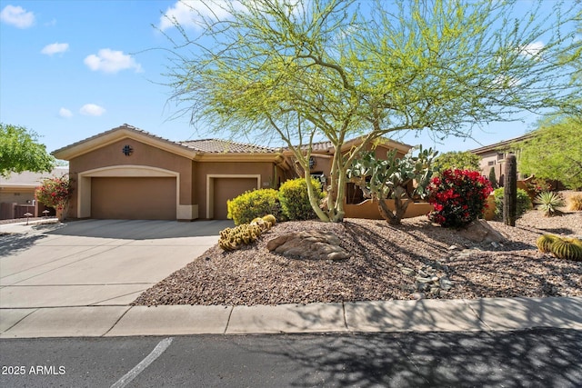 41910 N Long Cove Way, Anthem, AZ 85086 - view of front of home with a tile roof, stucco siding, a garage, and concrete driveway