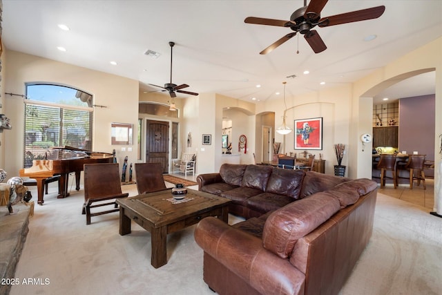 41910 N Long Cove Way, Anthem, AZ 85086 - living area featuring recessed lighting, a ceiling fan, arched walkways, and light carpet