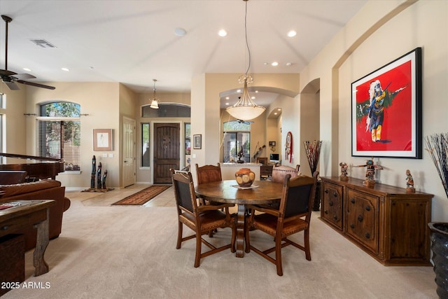 41910 N Long Cove Way, Anthem, AZ 85086 - dining space with light carpet, recessed lighting, a ceiling fan, visible vents, and arched walkways