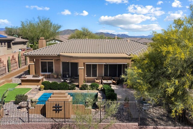 41910 N Long Cove Way, Anthem, AZ 85086 - rear view of property featuring a patio, a fenced backyard, and an outdoor hangout area