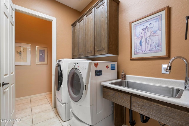 41910 N Long Cove Way, Anthem, AZ 85086 - laundry area with cabinet space, light tile patterned floors, separate washer and dryer, and a sink