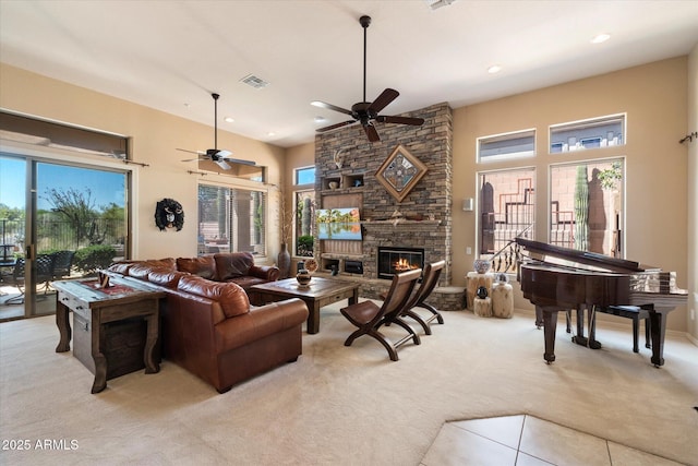 41910 N Long Cove Way, Anthem, AZ 85086 - living room featuring visible vents, a ceiling fan, a fireplace, recessed lighting, and light colored carpet