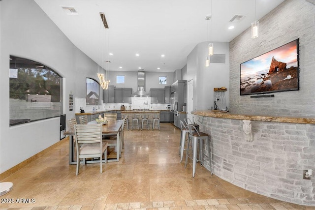 dining space featuring visible vents and recessed lighting