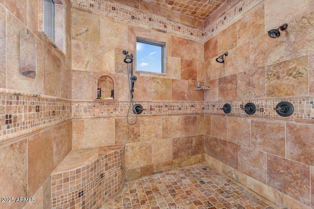 bathroom with tiled shower