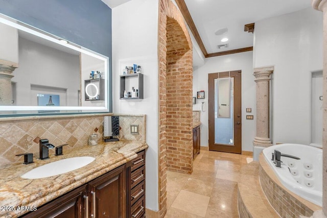 full bath with tasteful backsplash, visible vents, ornamental molding, a jetted tub, and vanity
