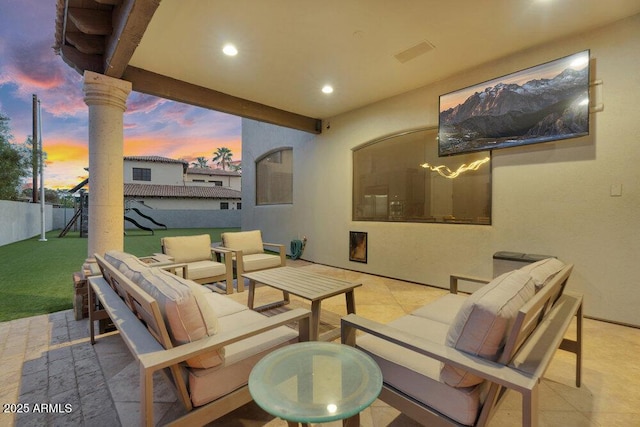 view of patio with fence and an outdoor hangout area