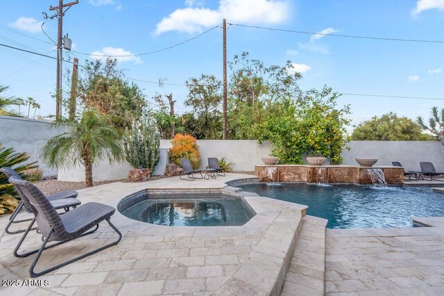 view of swimming pool featuring a patio area, a fenced backyard, an in ground hot tub, and a fenced in pool