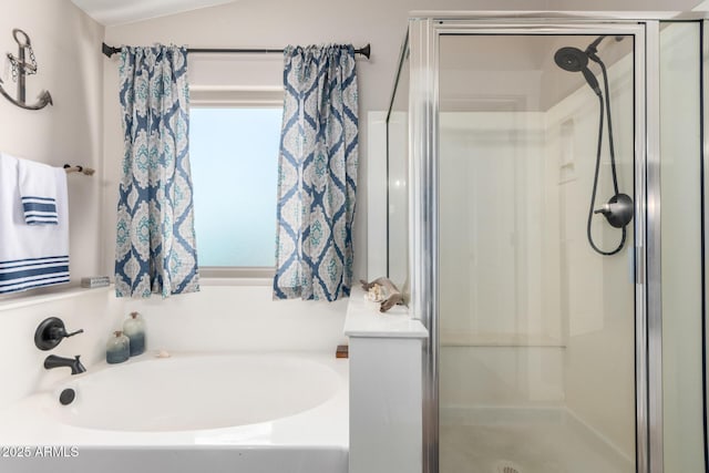 full bathroom featuring a shower stall and a bath