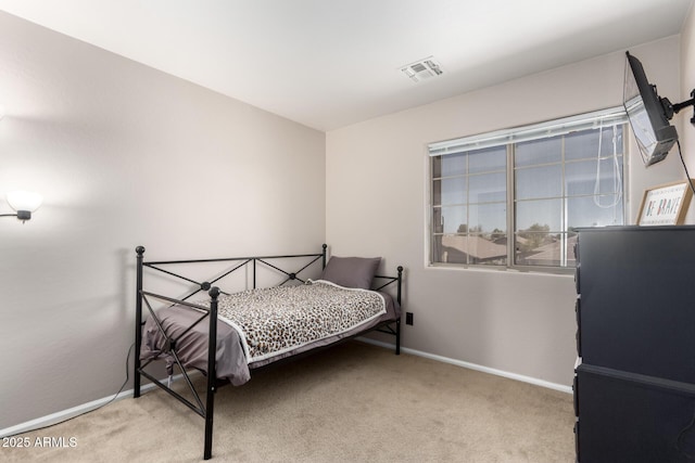 carpeted bedroom with baseboards