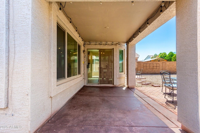 view of patio featuring fence