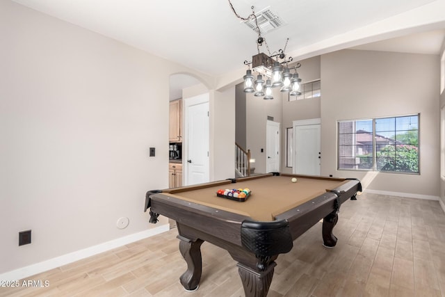rec room with baseboards, light wood finished floors, arched walkways, and pool table