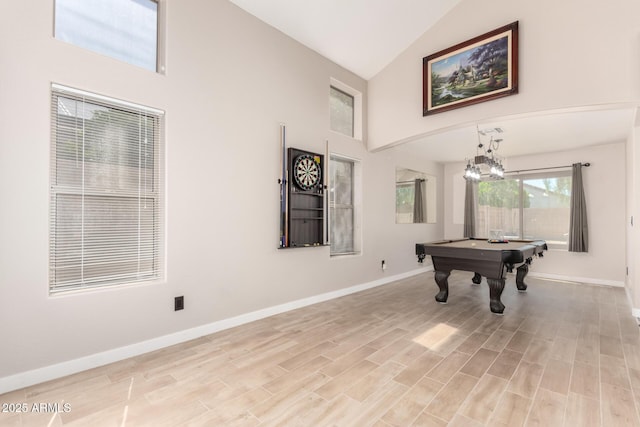 rec room with high vaulted ceiling, baseboards, billiards, and light wood finished floors