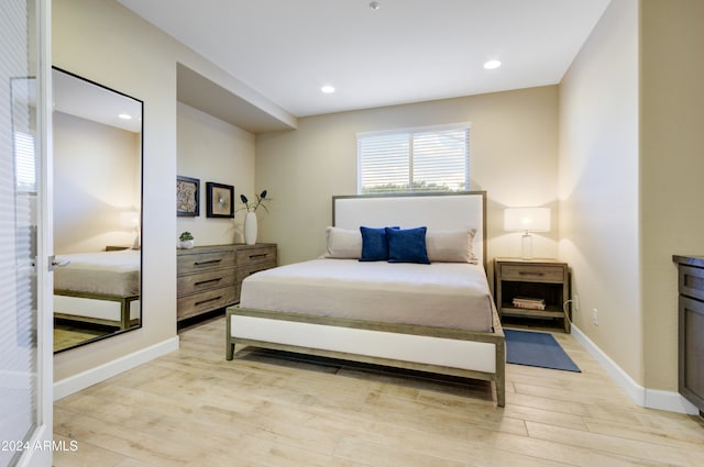 bedroom featuring light hardwood / wood-style floors