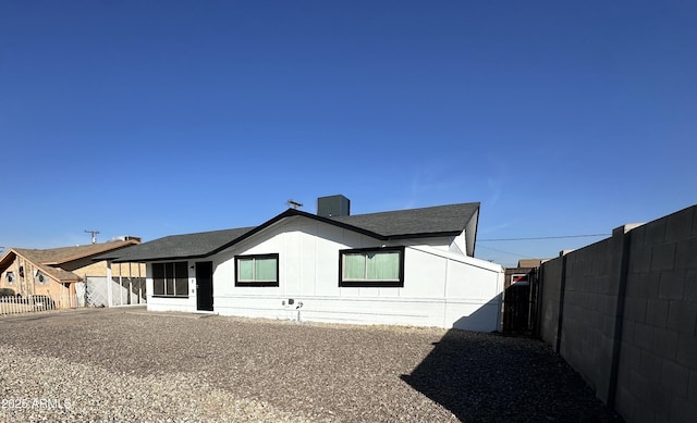 view of property exterior with fence