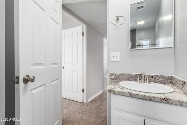 bathroom featuring vanity and tile patterned flooring