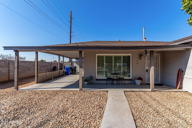 rear view of property featuring a patio area