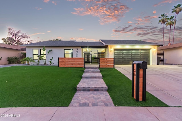 720 E Chilton Dr, Tempe, AZ 85283 - view of front facade featuring concrete driveway, stucco siding, an attached garage, and a front yard
