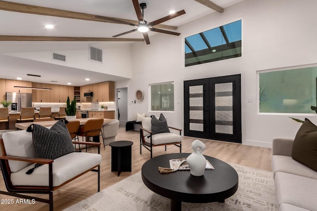 720 E Chilton Dr, Tempe, AZ 85283 - living area with light wood-style flooring, a ceiling fan, beamed ceiling, high vaulted ceiling, and french doors