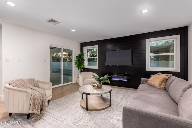 720 E Chilton Dr, Tempe, AZ 85283 - living room with recessed lighting, wood finished floors, and a glass covered fireplace
