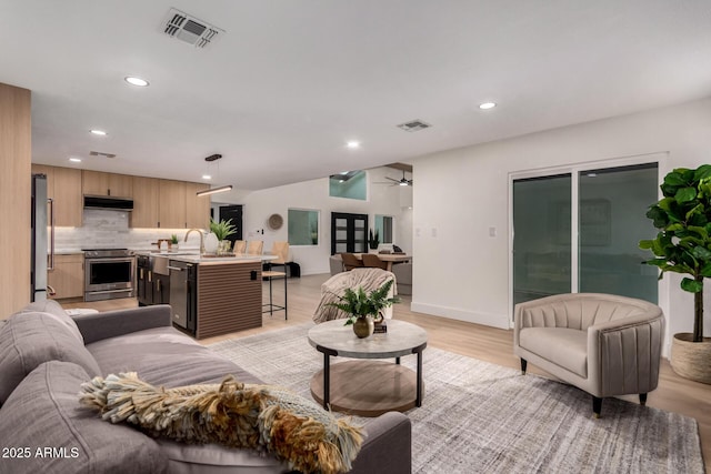 720 E Chilton Dr, Tempe, AZ 85283 - living area featuring recessed lighting, ceiling fan, and light wood finished floors