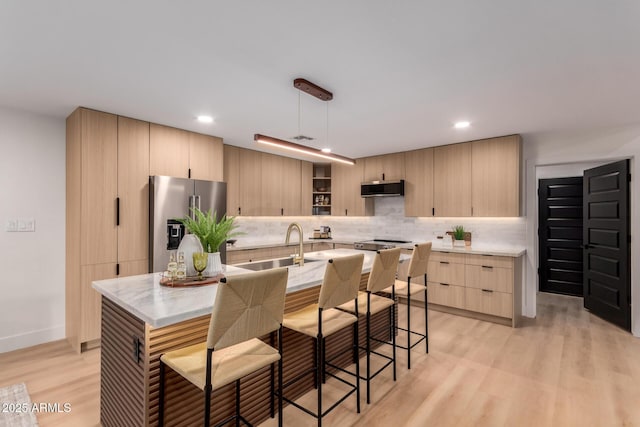 720 E Chilton Dr, Tempe, AZ 85283 - kitchen with stainless steel fridge with ice dispenser, light brown cabinets, extractor fan, backsplash, and light wood-style flooring