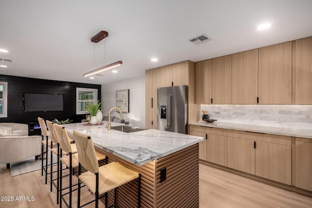720 E Chilton Dr, Tempe, AZ 85283 - kitchen featuring high end fridge, light brown cabinetry, light wood finished floors, and recessed lighting