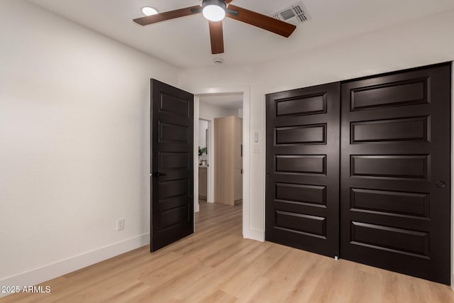 720 E Chilton Dr, Tempe, AZ 85283 - unfurnished bedroom featuring baseboards and light wood finished floors