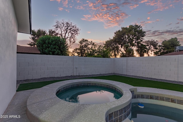 720 E Chilton Dr, Tempe, AZ 85283 - pool at dusk featuring an in-ground hot tub and a fenced backyard