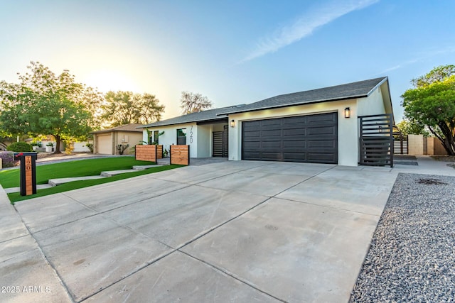 720 E Chilton Dr, Tempe, AZ 85283 - view of front of house with a garage, concrete driveway, and stucco siding