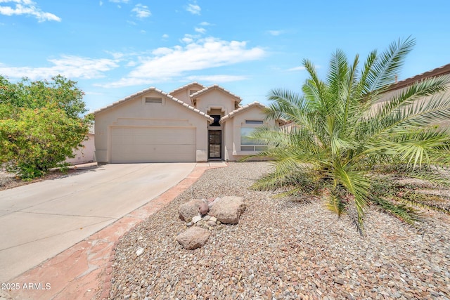 18644 N 21st St, Phoenix, AZ 85024 - view of front of house featuring concrete driveway, stucco siding, a garage, and a tile roof