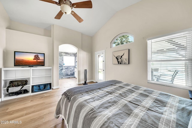18644 N 21st St, Phoenix, AZ 85024 - bedroom featuring light wood-style floors, multiple windows, high vaulted ceiling, a ceiling fan, and arched walkways