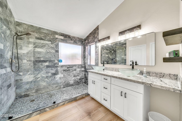 18644 N 21st St, Phoenix, AZ 85024 - bathroom featuring a walk in shower, double vanity, and vaulted ceiling