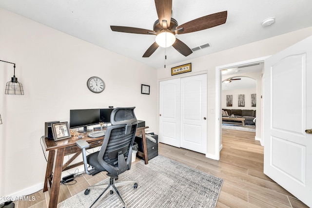 18644 N 21st St, Phoenix, AZ 85024 - office area with a ceiling fan, arched walkways, light wood-type flooring, and baseboards