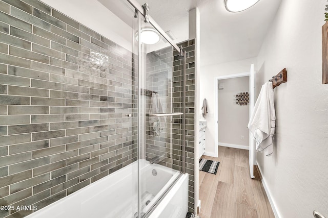 18644 N 21st St, Phoenix, AZ 85024 - full bathroom featuring shower / bath combination with glass door, wood finished floors, and baseboards