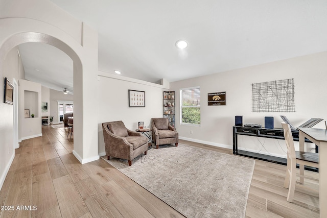 18644 N 21st St, Phoenix, AZ 85024 - living room with healthy amount of natural light, light wood-type flooring, baseboards, recessed lighting, and arched walkways