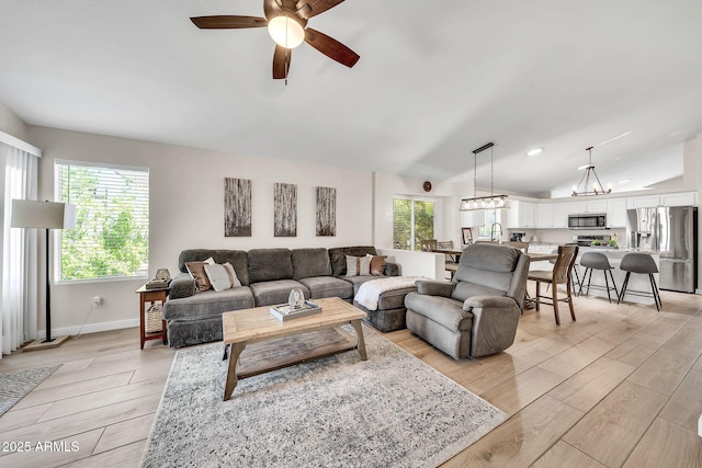 18644 N 21st St, Phoenix, AZ 85024 - living area featuring light wood-style flooring, a ceiling fan, lofted ceiling, and baseboards