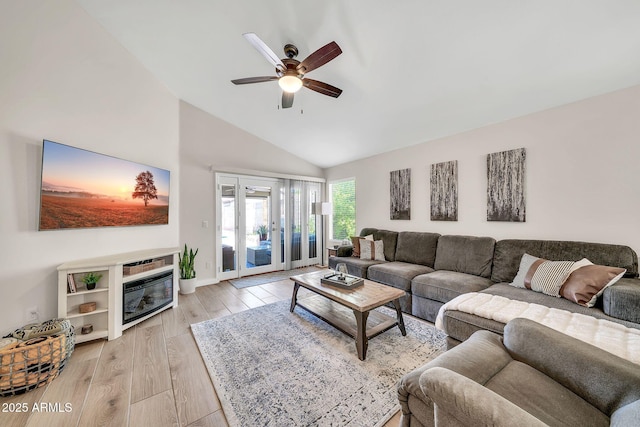 18644 N 21st St, Phoenix, AZ 85024 - living room featuring vaulted ceiling, ceiling fan, and light wood-type flooring