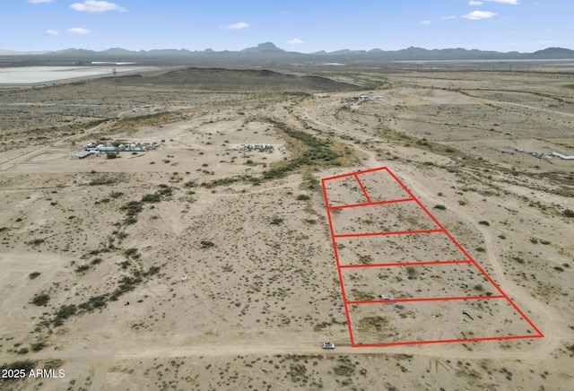 bird's eye view with view of desert and a mountain view