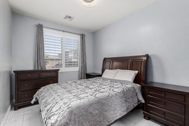 bedroom with light tile patterned floors