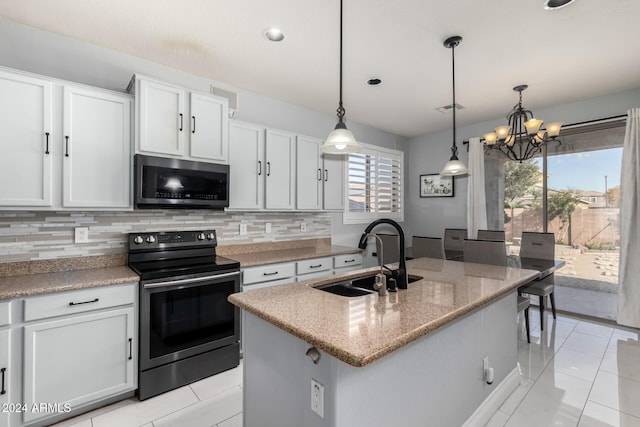 kitchen with sink, stainless steel appliances, pendant lighting, a kitchen island with sink, and white cabinets