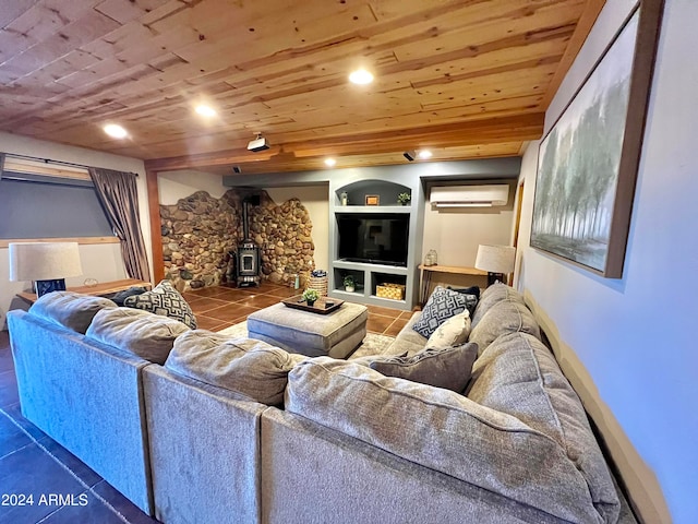 living room featuring light tile floors, wood ceiling, built in shelves, a wall mounted air conditioner, and a wood stove