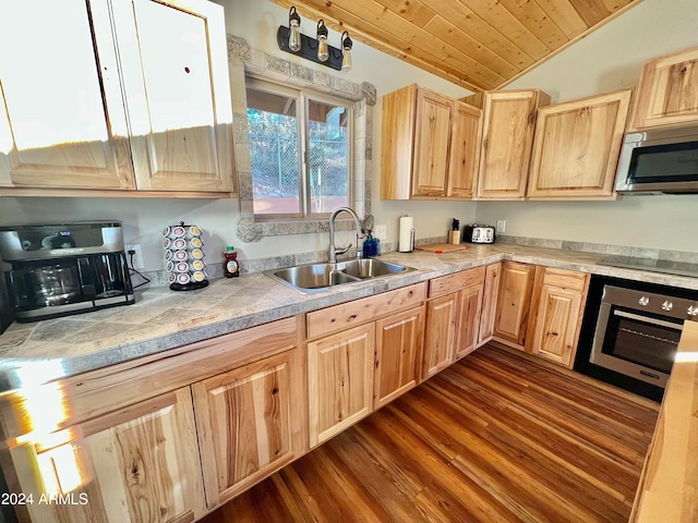 kitchen with vaulted ceiling, dark wood-type flooring, wooden ceiling, and stainless steel appliances